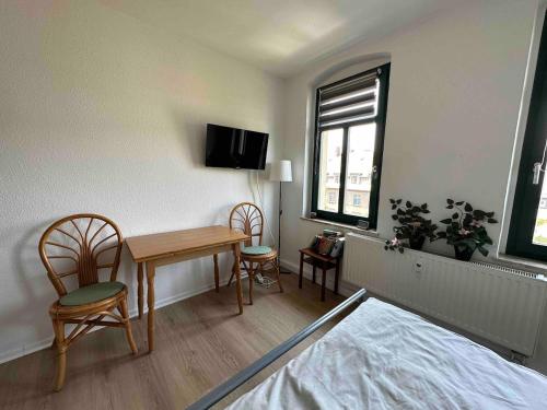 Μια τηλεόραση ή/και κέντρο ψυχαγωγίας στο 1,5 Zimmer für 4 Personen auf 38qm Wohnfläche