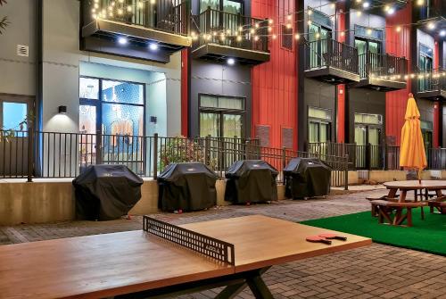 a wooden table in front of a building with tents at The Soundry in Nashville
