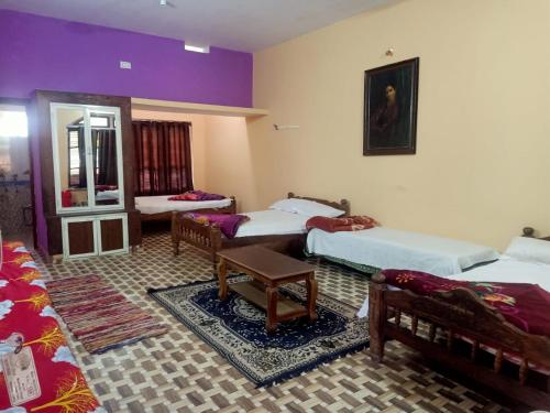 Ένα ή περισσότερα κρεβάτια σε δωμάτιο στο Valley Dew Village Stay