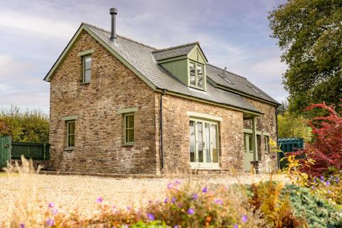 an old brick house with a gray roof at Waun Yscir Rural escape in the Brecon Beacons in Brecon