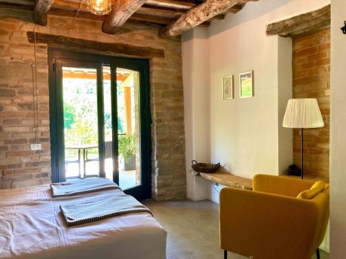 Ένα ή περισσότερα κρεβάτια σε δωμάτιο στο Agriturismo Unico Senso