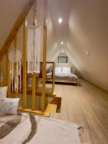 a large room with a bed and a large mirror at Chalés Luna In Rio Chalé Rio in Ponte da Barca