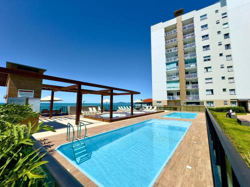 Πισίνα στο ή κοντά στο Aptos completo PÉ NA AREIA em Barra Velha em condomínio Resort com Spa, Piscina, quadra de futebol, Sala de jogos, brinquedoteca, Complexo com diversos comércios