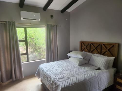 Ένα ή περισσότερα κρεβάτια σε δωμάτιο στο Neotha Villa