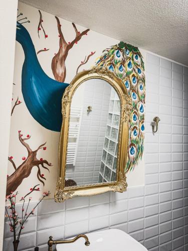 a bathroom with a mirror and a sink at Maus Haus in Vrdnik