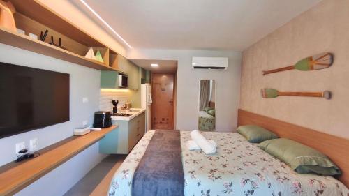 Postel nebo postele na pokoji v ubytování Atlântico Carneiros - Pé na areia no melhor trecho da Praia dos Carneiros