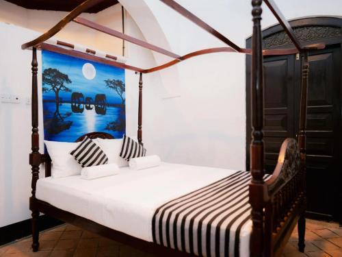 Ένα ή περισσότερα κρεβάτια σε δωμάτιο στο Villa 1908 Hikkaduwa