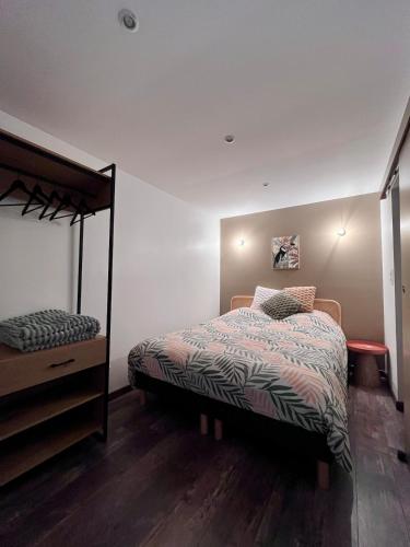 Ένα ή περισσότερα κρεβάτια σε δωμάτιο στο La Pomponnette