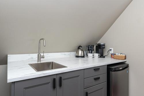 a kitchen with a sink and a counter top at Shawnigan Suite B & B in Shawnigan Lake