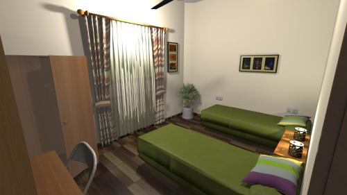 Una sala de estar con un sofá verde y una mesa. en Prisma21, en Luque