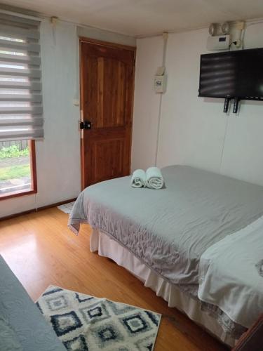 Postel nebo postele na pokoji v ubytování Hostal Costa patagonica