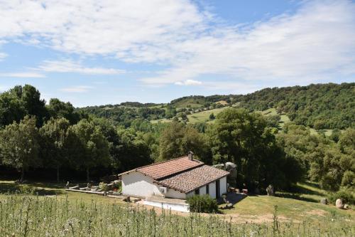 a small house in the middle of a field at B&B I Menhir in Sorgono