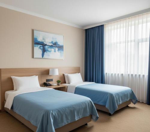 Postel nebo postele na pokoji v ubytování Novarell Resort Hotel