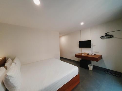 Ένα ή περισσότερα κρεβάτια σε δωμάτιο στο The Sila Suites - Intrawarorot