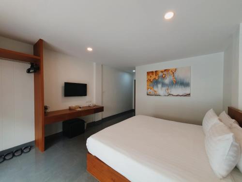 Ένα ή περισσότερα κρεβάτια σε δωμάτιο στο The Sila Suites - Intrawarorot