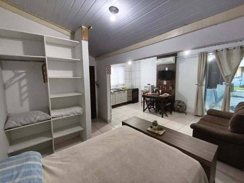 Ένα ή περισσότερα κρεβάτια σε δωμάτιο στο FLAT Promoção Mensal