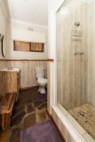 a bathroom with a toilet and a shower at Estuary Breeze in Sedgefield