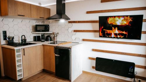 Η κουζίνα ή μικρή κουζίνα στο La Canopée Jurassienne