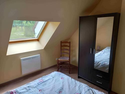 Ένα ή περισσότερα κρεβάτια σε δωμάτιο στο L'Atout de France