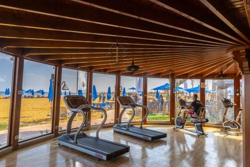 a gym with cardio machines and a view of the desert at La Cabana Beach Hotel Ain Sokhna in Ain Sokhna