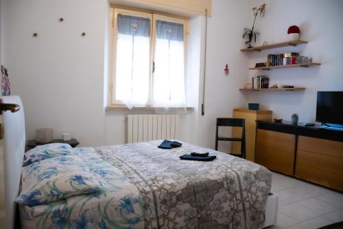 Ένα ή περισσότερα κρεβάτια σε δωμάτιο στο Relax al mare, appartamento Gelsomino