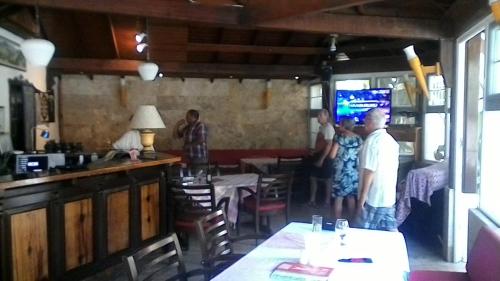 a group of people standing in a restaurant at Central Park Otel - Adult Only in Dalyan