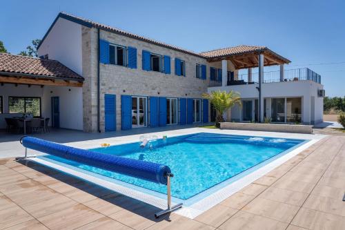 Villa Blue Moon for 9 persons near Porec with 42 m2 heated pool, wellness, kids playground & sea view
