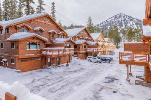 a group of log homes in the snow at Mountainside 15 in Mammoth Lakes