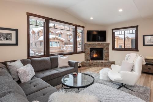 a living room with a couch and a fireplace at Mountainside 15 in Mammoth Lakes