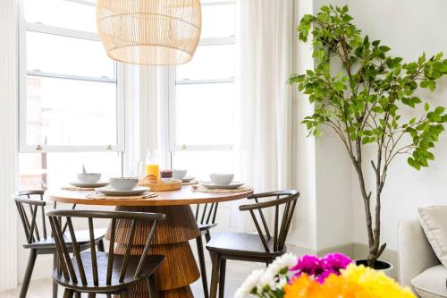 a dining room with a table and chairs at Apartment Nine Pelican House in Bournemouth