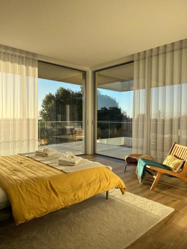 a bedroom with a bed and a large window at Villa Mar & Luz, Porto, Mindelo Beach in Mindelo