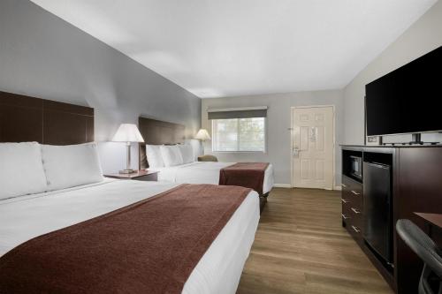 Ένα ή περισσότερα κρεβάτια σε δωμάτιο στο Best Western Lake Conroe Inn