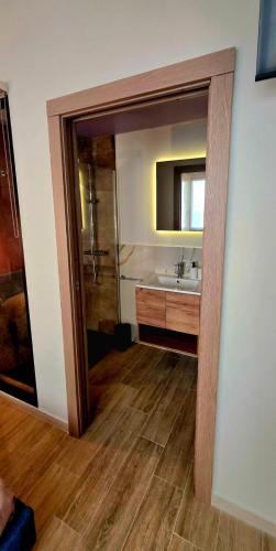 a bathroom with a sink and a mirror at SeaDoor in Livorno