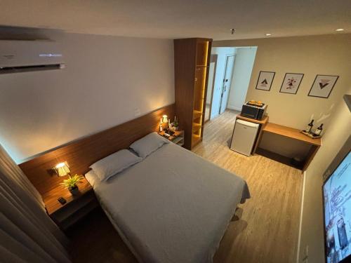 Postel nebo postele na pokoji v ubytování Transamérica Executive Campos dos Goytacazes