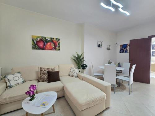 a living room with a couch and a table at CJ SEA HOME CAMERE in Trapani