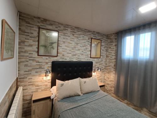Postel nebo postele na pokoji v ubytování ESTUDIO FAMILIAR En EZCARAY
