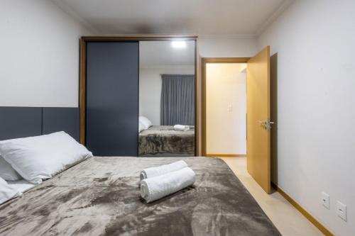 En eller flere senge i et værelse på Com piscina próximo a Vila Germânica RN4960