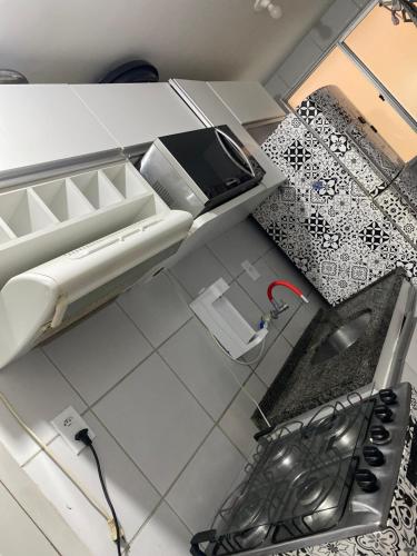 an overhead view of a kitchen with a stove and a sink at Apartamento Solaris in São Luís