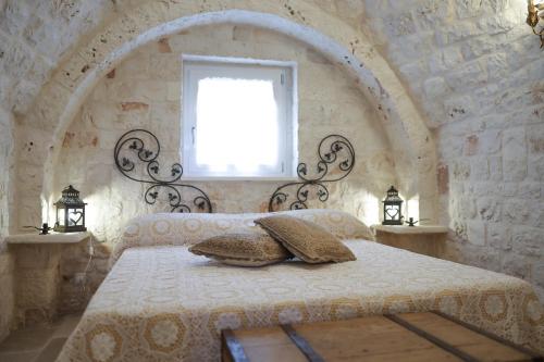 Postel nebo postele na pokoji v ubytování I Trullarelli