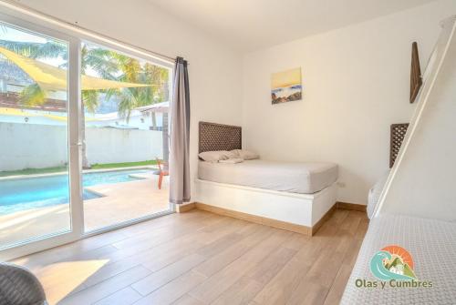 En eller flere senge i et værelse på Villa Los Delfines 1