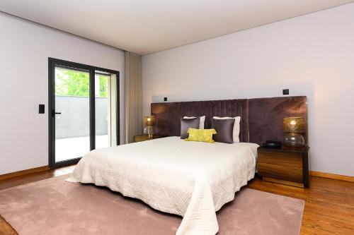 Ένα ή περισσότερα κρεβάτια σε δωμάτιο στο AB Villa Real-Estate