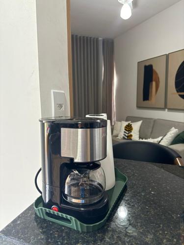 Kaffe- og tefaciliteter på Apartamento novo e completo