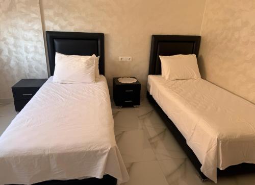 Ένα ή περισσότερα κρεβάτια σε δωμάτιο στο Bahija