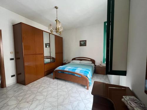 Giường trong phòng chung tại Casa Vacanza In Paese