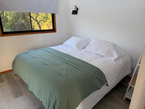 Postel nebo postele na pokoji v ubytování Tiny House El Maiten