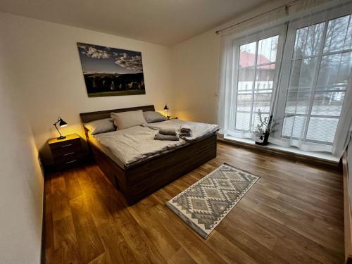 Postel nebo postele na pokoji v ubytování Apartmán Mařinka