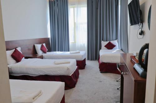 Postel nebo postele na pokoji v ubytování فندق الاصول