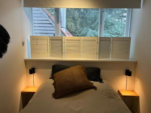 Cama o camas de una habitación en Van de Gruiterwonen