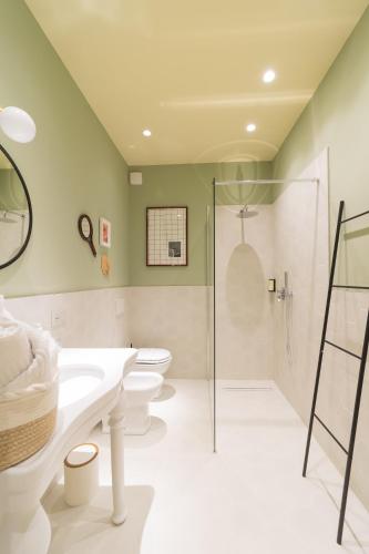 a bathroom with two toilets and a shower at L'Ombra dell'Ulivo B&b in Marsala