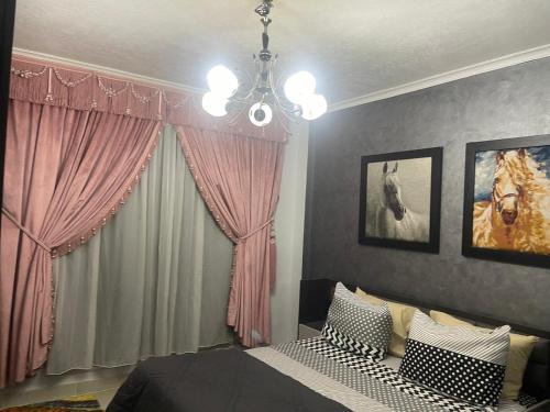 Ένα ή περισσότερα κρεβάτια σε δωμάτιο στο Cozy Comfort Flat , Madinaty